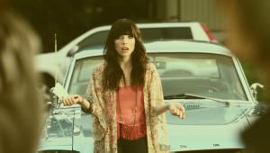 A screen shot from its music video. A screen shot from its music video.